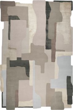 an area rug with different colors and shapes on the floor, including greys, beiges