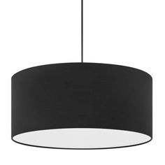 a black and white lamp hanging from a ceiling fixture with a round light shade on it