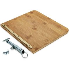 a wooden cutting board with two pieces of wood on it and a pair of screws next to it