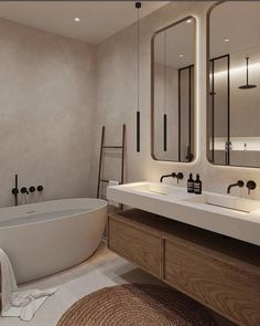 a large bathroom with two sinks and a bathtub