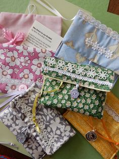 many different types of fabric bags on a table