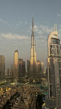 an aerial view of a city with skyscrapers and other high rise buildings in the foreground