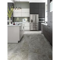 a modern kitchen with gray and white tile flooring