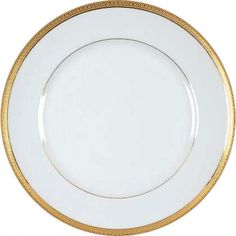 a white plate with gold trimmings on the rim and bottom, against a white background