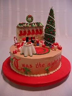 a decorated christmas cake sitting on top of a red plate