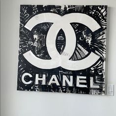 a black and white painting with the word chanel on it