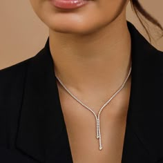 The Lily Necklace is all about effortless elegance. Encircling the neck in 3.38 carats of glittering diamonds, this style doubles up on sparkle with two asymmetrical drops featuring bezel-set pear diamonds resting on each end. Y Necklace Diamond, Single Line Diamond Necklace, Modern Diamond Necklace, Elegant Diamond Necklace, Modern Necklace Design, Lily Necklace, Diamond Drop Necklace, Double Necklace, Modern Necklace