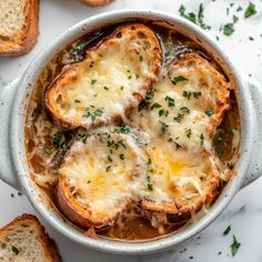 baked bread with melted cheese in a white bowl