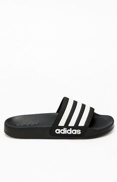 Enjoy your casual days in style and comfort thanks to the Kids Black Adilette Slide Sandals by adidas. These go-to slides have a single-strap design with 3-Stripes detailing and contoured footbeds for all-day comfort.Two-tone slidesadidas branding3-Stripes detailingThick single strapContoured footbedsTextured outsoles adidas Kids Black Adilette Slide Sandals size 2 Kids Slides For Kids, Adidas Slides, Black Slides, Adidas Kids, Kids Slide, 2 Kids, Kids Black, Strap Design, Slide Sandals