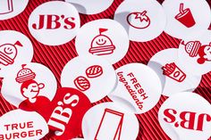 red and white stickers with different types of food on them, including burgers