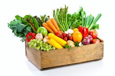 a wooden box filled with lots of different types of vegetables