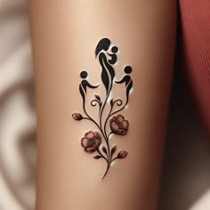 a woman's leg with a tattoo on it that has an image of two people and flowers