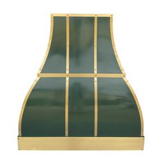 a green and gold colored stove hood on a white background with no one around it