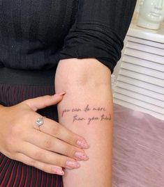 a woman's arm with a tattoo that says you can do more than you think