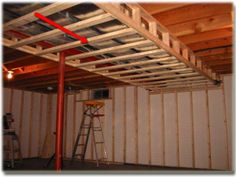 the inside of a storage room with ladders