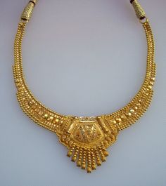 TRADITIONAL DESIGN 20kt GOLD NECKLACE CHOKER FROM RAJASTHAN INDIA, GREAT HANDMADE DESIGN, MADE OF SOLID 20kt YELLOW GOLD, GOOD FOR JEWELLERY COLLECTION. NECKLACE LENGTH CAN BE ADJUST BY NACK THREAD KNOT. Gold piece Length - 21 cm(8.26") width max.- 3.5 mm Gross weight - 20 grams Net gold weight - 16 grams Material - 20k solid yellow gold. Note-All the items appear In Pictures larger than actual in size so please check measurements carefully before purchase. Bengali Jewellery, Gold Necklace Choker, Indian Gold Necklace Designs, Gold Chokers, Gold Bridal Necklace, Choker Handmade, Belly Dance Jewelry, Gold Necklace Indian, Beautiful Gold Necklaces