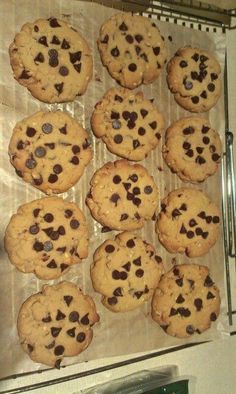 chocolate chip cookies on a baking sheet ready to be baked in the oven for consumption