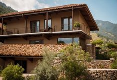 a house with a thatched roof in the mountains