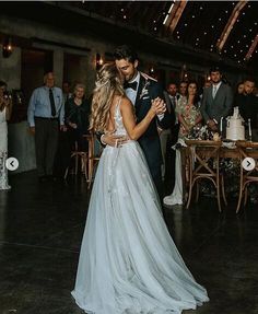 a bride and groom sharing their first dance