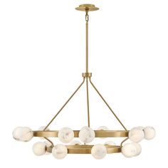 a brass chandelier with white glass balls hanging from the bottom, on an isolated ceiling