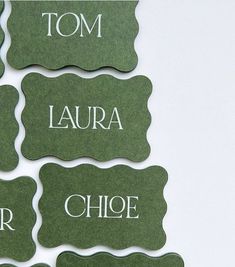 green name tags with white writing on them