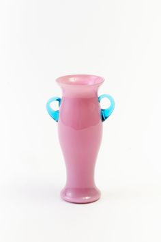 Vintage pink glass vase with blue handles. Parlor Games, Entry Hall, Glass Vases, Vintage Vases, Linen Pillows, Cocktail Napkins, Vintage Beauty, Ornament Gifts, Holiday Collection