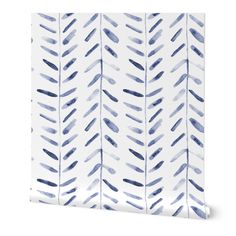 a blue and white wallpaper with watercolor paint strokes on the back of it