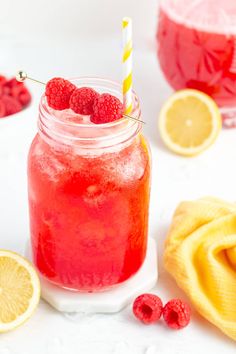 raspberry lemonade in a mason jar with a striped straw