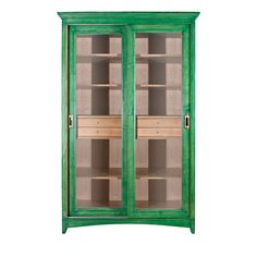 a green cabinet with two glass doors on the front and one door open to show shelves