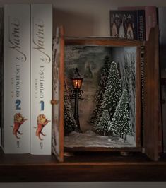 a book shelf with books on it and a lamp in the middle surrounded by other books