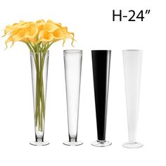 three tall vases with yellow flowers in them