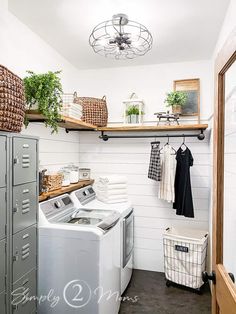 a washer and dryer in a small room with open shelving on the wall