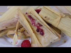 two tamales with raspberries on the side