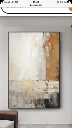 an abstract painting hanging on the wall in a room