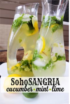 there are two pitchers of water with lemons and mint