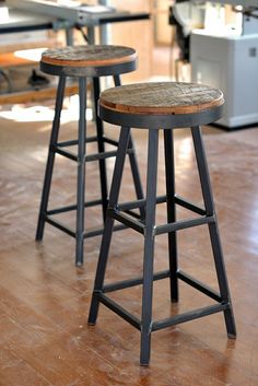 two stools sitting on top of a hard wood floor