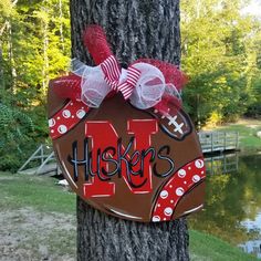 a wooden sign that says hope hanging on a tree