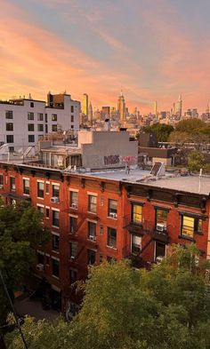 an apartment building in the city at sunset