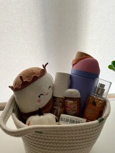 a white basket filled with lots of different items