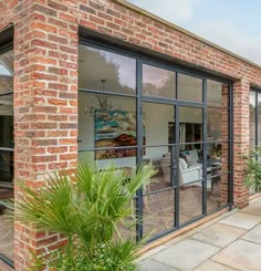 a brick building with glass doors and windows