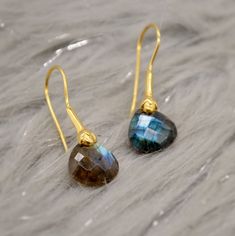 Discover the captivating allure of our Labradorite Dangle Earrings - a mesmerizing addition to your jewelry collection. Handcrafted with love, these unique earrings showcase the enchanting beauty of blue labradorite, delicately set in gold-plated silver. Elevate your style with these exquisite gemstone earrings, perfect for any occasion - be it Christmas, anniversaries, Mother's Day, Valentine's, or birthdays. Unleash your inner radiance and charm with these stunning boho drop earrings. Shop now Dangle Silver Earrings, Gifts Boho, Boho Drop Earrings, Labradorite Earrings, Blue Topaz Earrings, Labradorite Jewelry, Earrings Christmas, Topaz Earrings, Blue Labradorite