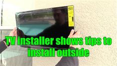 a person holding up a television with the words tv install shows tips to install outside