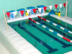 an inflatable swimming pool with red, white and blue flags