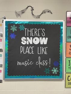 there's snow place like music class on the blackboard in front of the bulletin board