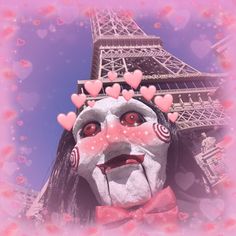 a woman with her face painted to look like the eiffel tower in paris