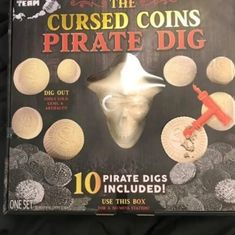 the book is opened to show an image of a pirate's skull and other items