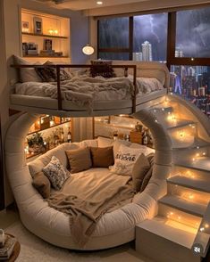 a spiral bed in the middle of a room with stairs leading up to it's second floor