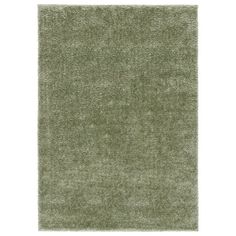 a green rug on a white background with no one in the room to see it