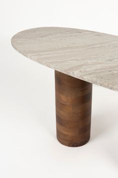 a marble table with a wooden base on a white background in the shape of an oval