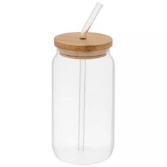 a glass jar with a wooden lid and a straw in it